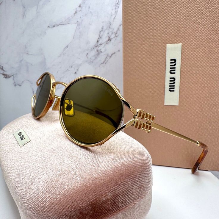 Miu Miu Oval Shape Negro Gold